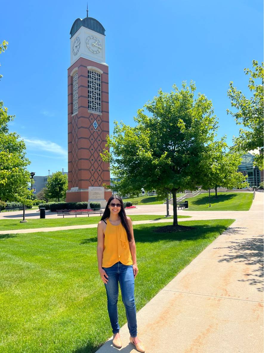 Angie Perez Vanegas in front of the clock tower